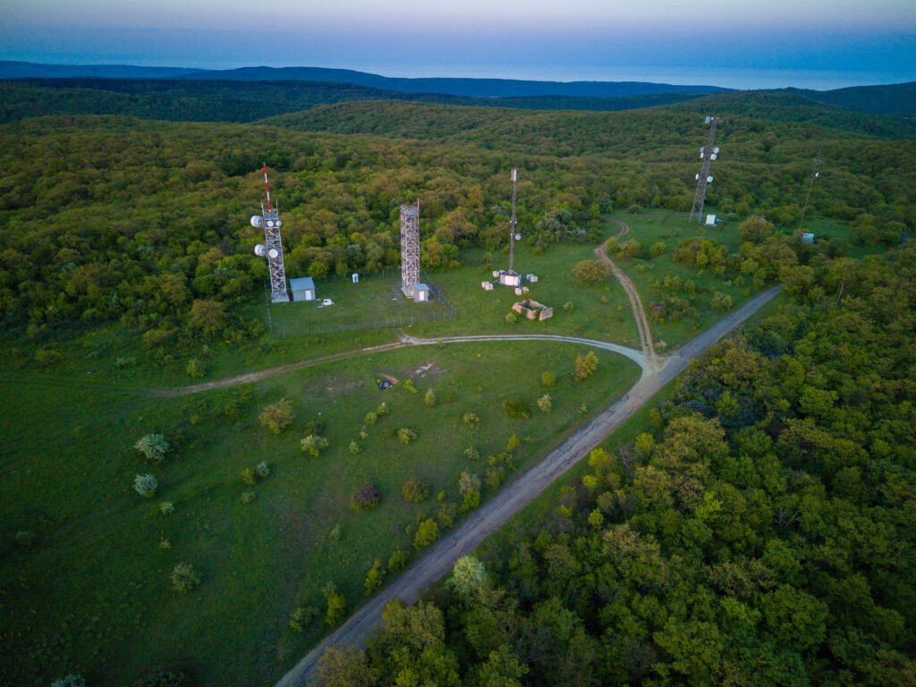 Aerial view of cell towers on leased land, illustrating property opportunities for a Lease Buyout to maximize financial returns.