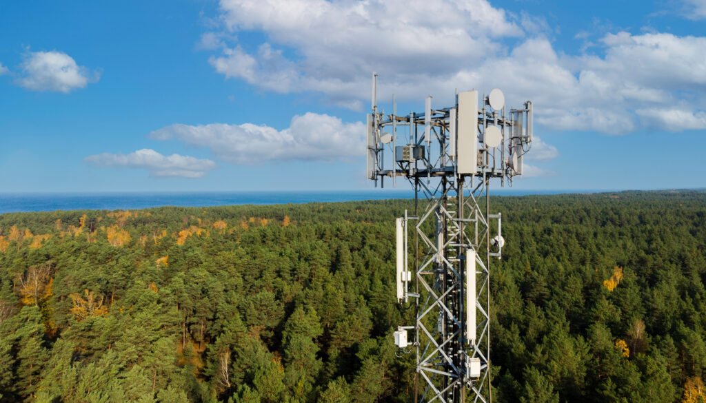 Telecommunication cell tower on a property, illustrating a Cell Tower Lease generating long-term income for property owners.